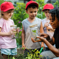 Teacher and kids school learning ecology gardening